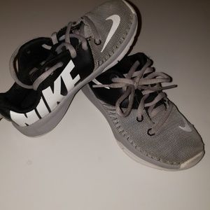 Kids grey Nike sneakers